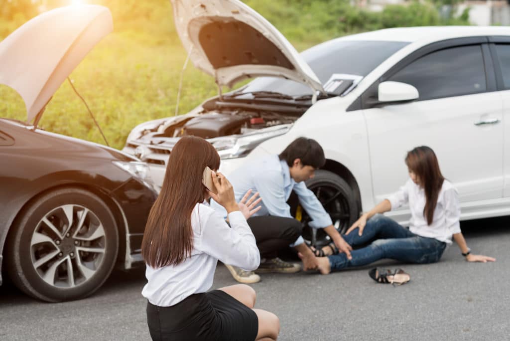 someone calls 911 as another person suffers an auto injury from a head-on crash