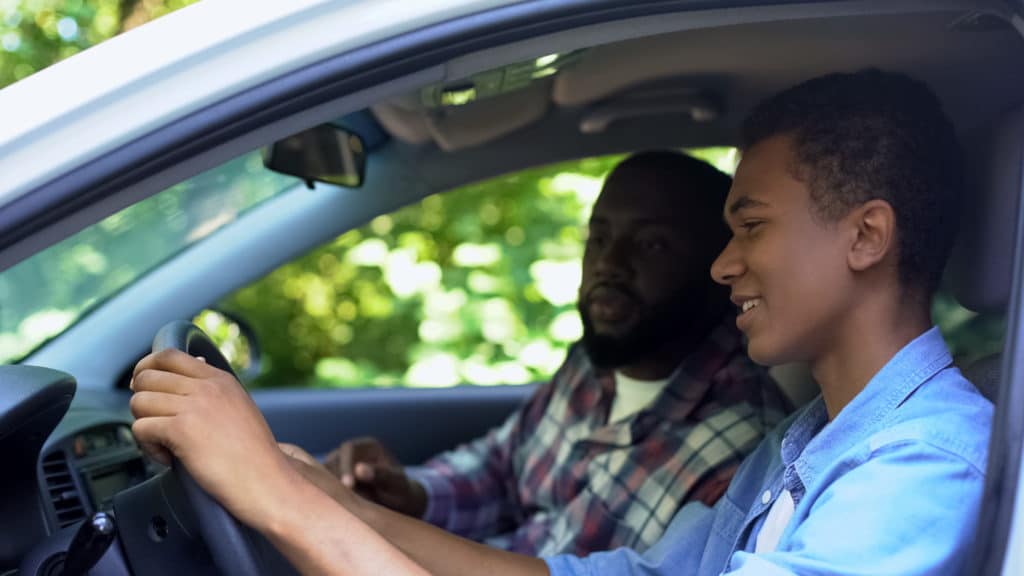 teen driver chatting to their friend after a low-speed collision