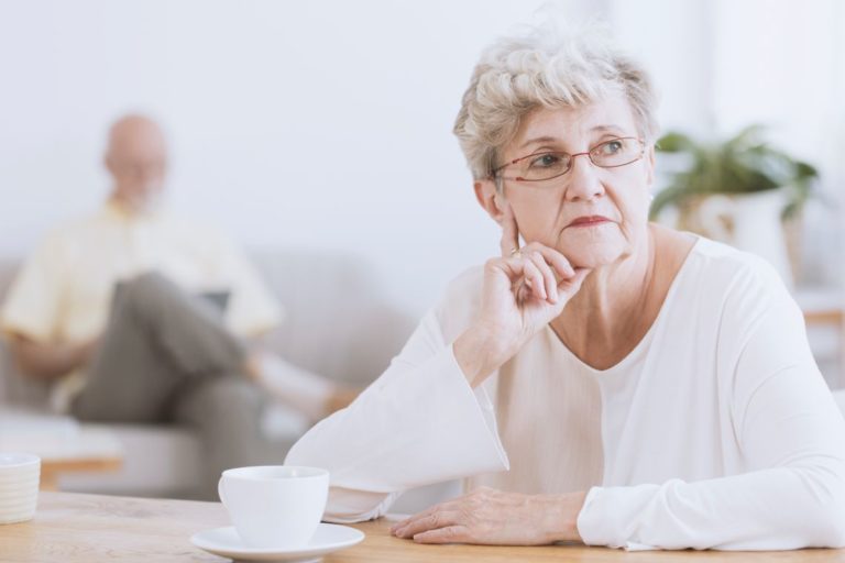 woman who used talcum powder sits with a cup of coffee